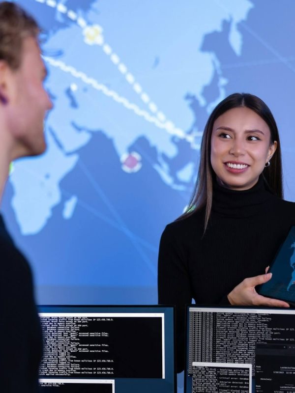 smiling-cyber-security-team-working-in-a-cyber-security-operations-center-soc-to-protect-systems-and.jpg